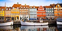 Boats and rowhouses in Nyhavn Harbor in Copenhagen, Denmark