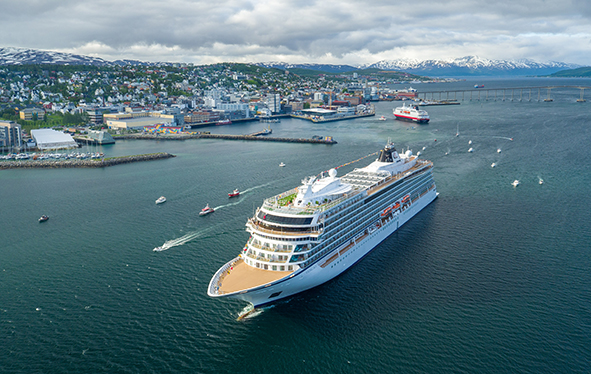 Aerial view of a Viking ocean ship sailing past Tromsø, Norway