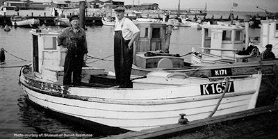 Historical photo of Danish fishermen on boat
